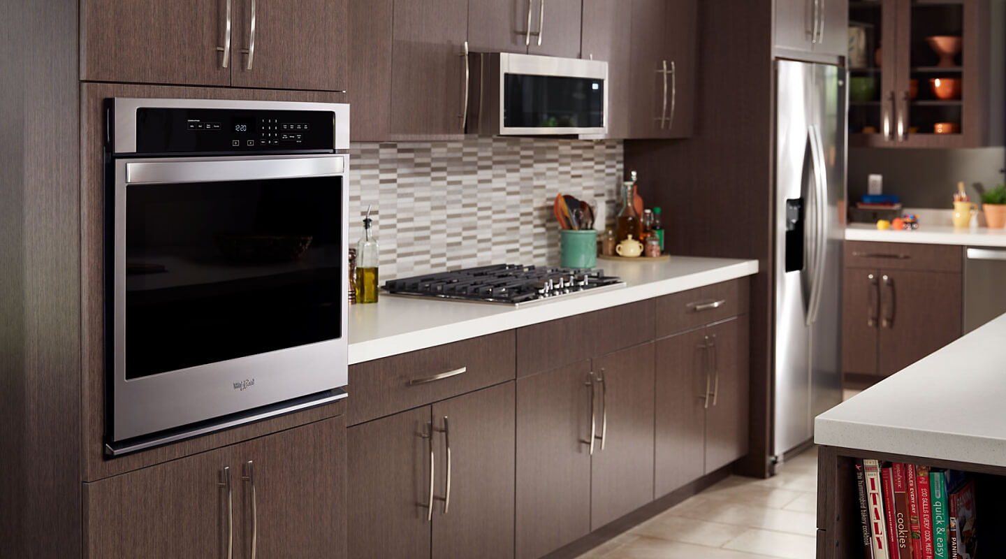Stainless steel Whirlpool® wall oven in a modern kitchen