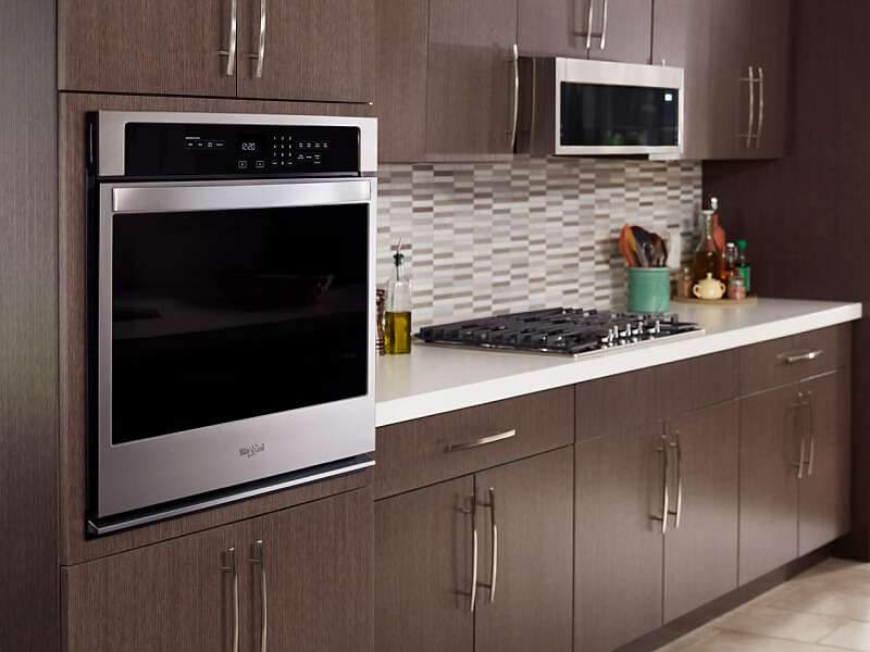 Stainless steel Whirlpool® wall oven in a modern kitchen