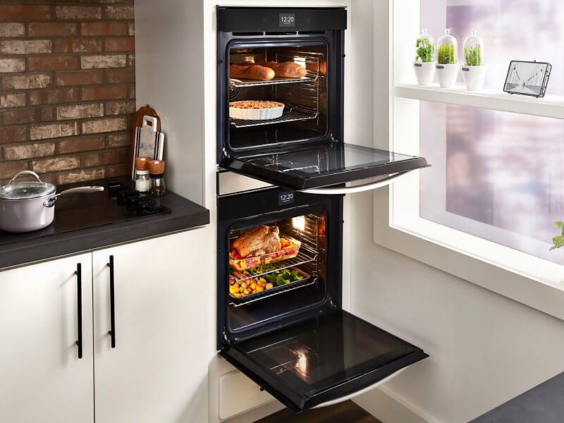 Multiple dishes cooking inside a Whirlpool® double wall oven