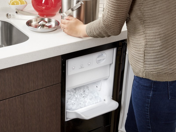Ice maker underneath a kitchen counter