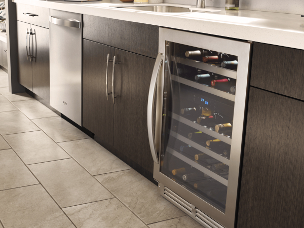 Wine refrigerator in between kitchen cabinets