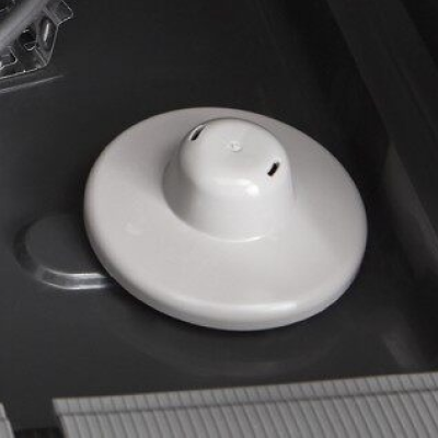 An overfill protection float at the base of a Whirlpool® dishwasher.