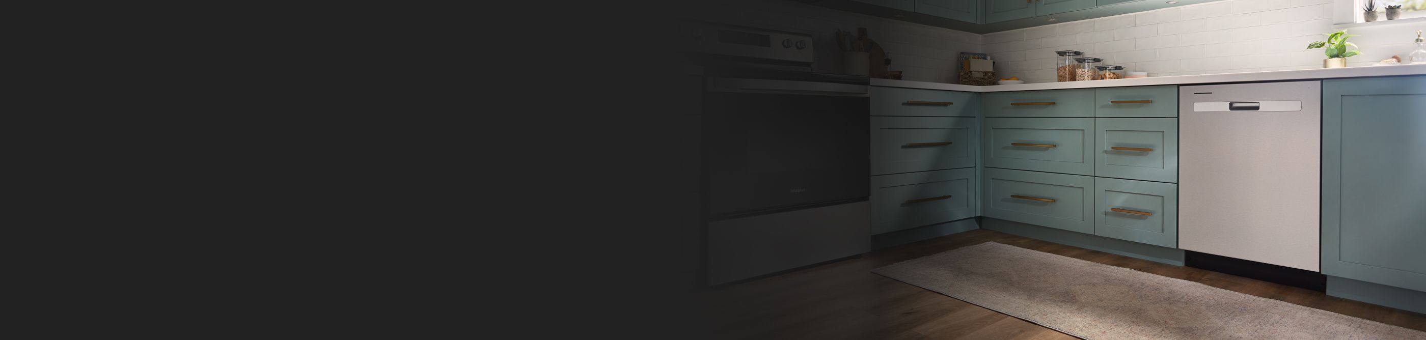 Whirlpool® electric range in a kitchen with teal cabinets