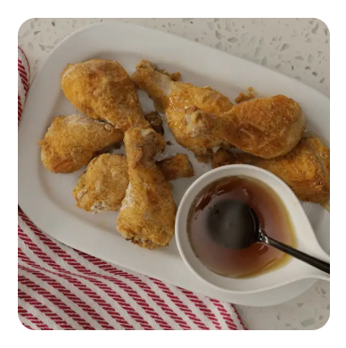 Chicken wings on a plate with dipping sauce
