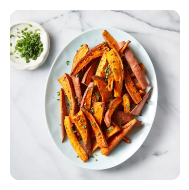 Sweet potato fries plated with a side of aioli