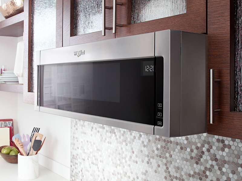 Low profile microwave from Whirlpool brand in brown cabinetry