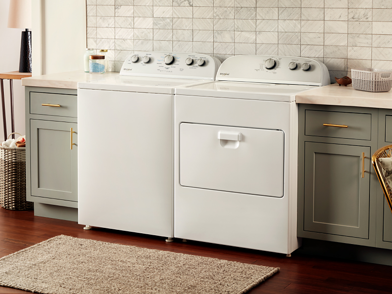 White Whirlpool® washer and dryer in a laundry room