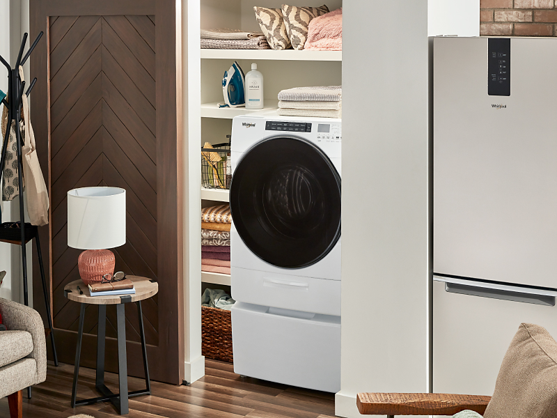White Whirlpool® combination washer and dryer in a closet