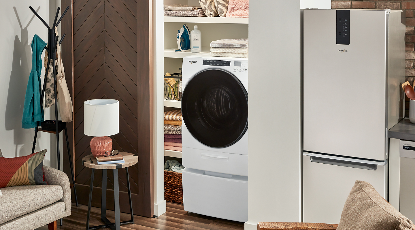 White Whirlpool® combination washer and dryer in a closet