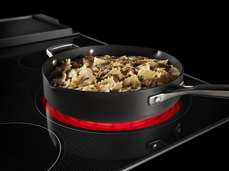 Cooked pasta in a pan on a Maytag® induction cooktop