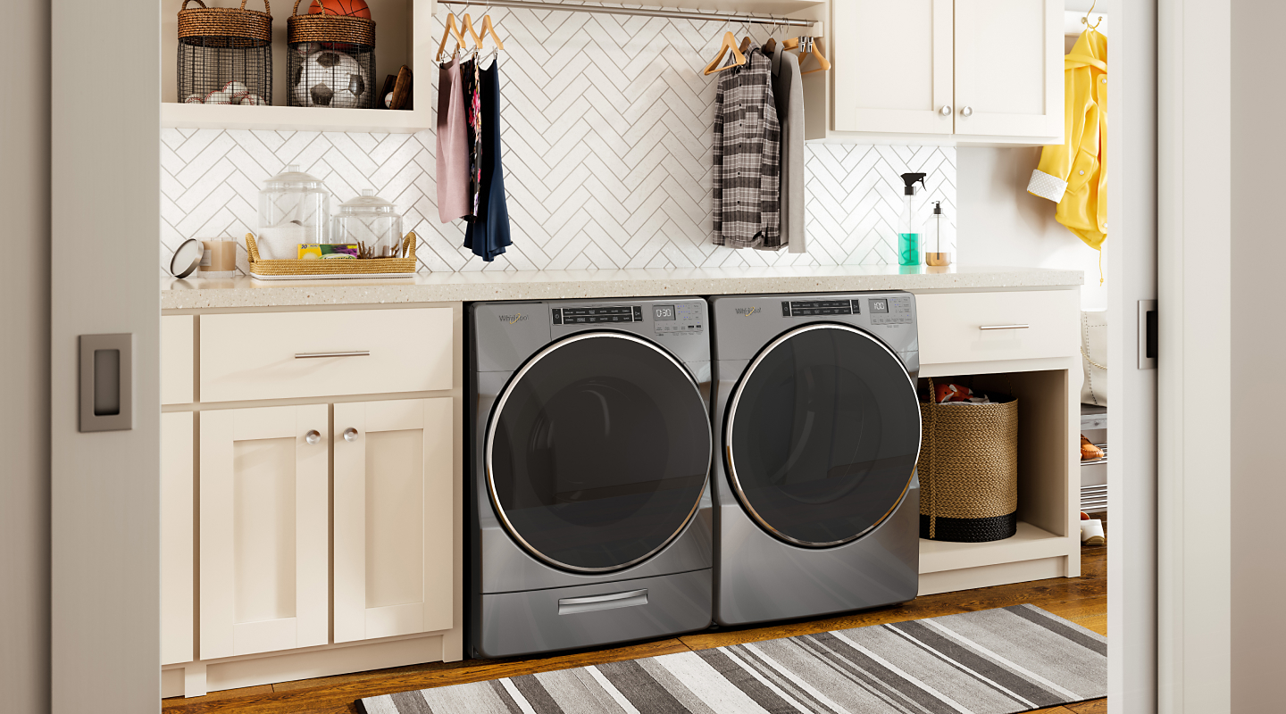 Stainless steel Whirlpool® washer and dryer set in laundry room