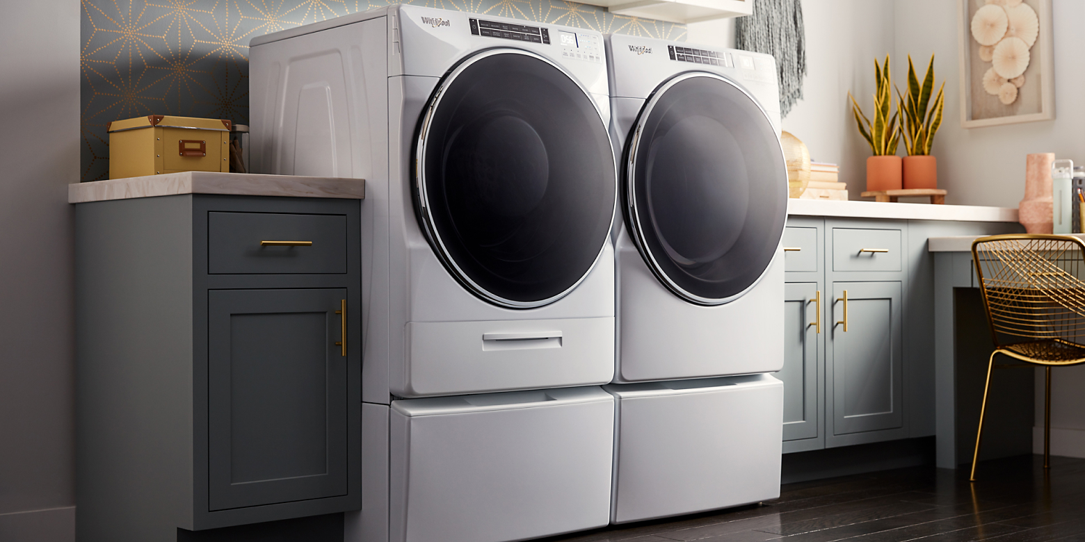 A front load washer and dryer in a laundry room