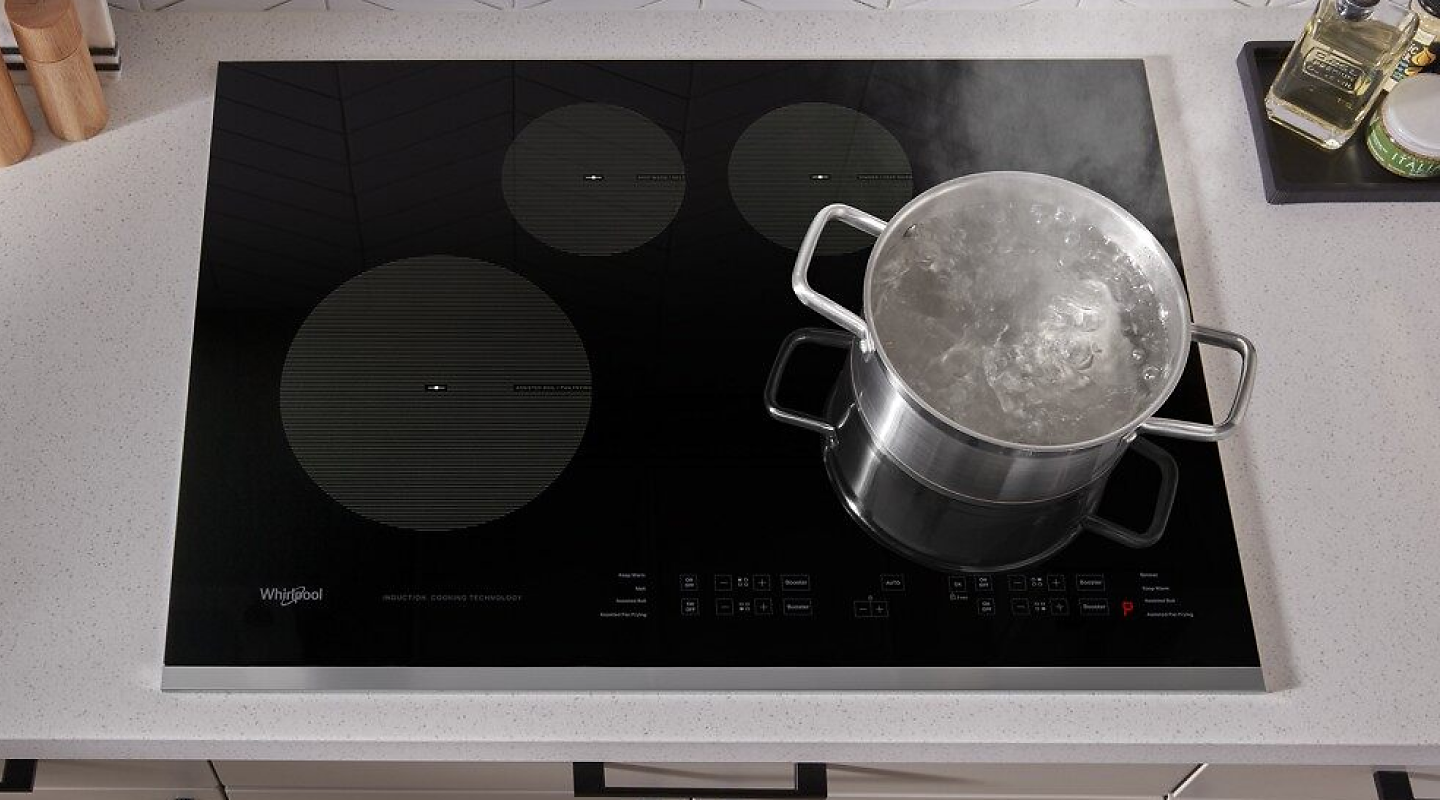Pot of water boiling on a Whirlpool® induction cooktop.