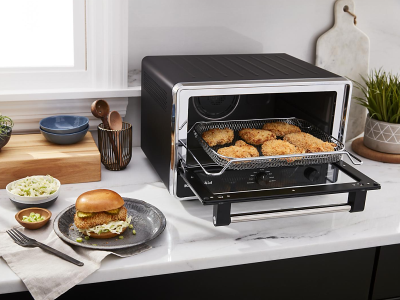 Breaded chicken inside a toaster oven