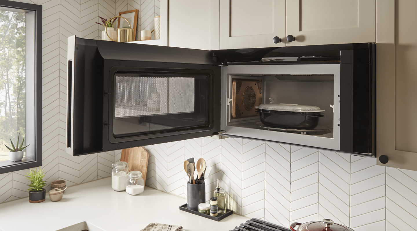 Open over-the-range microwave with a microwave-safe dish inside