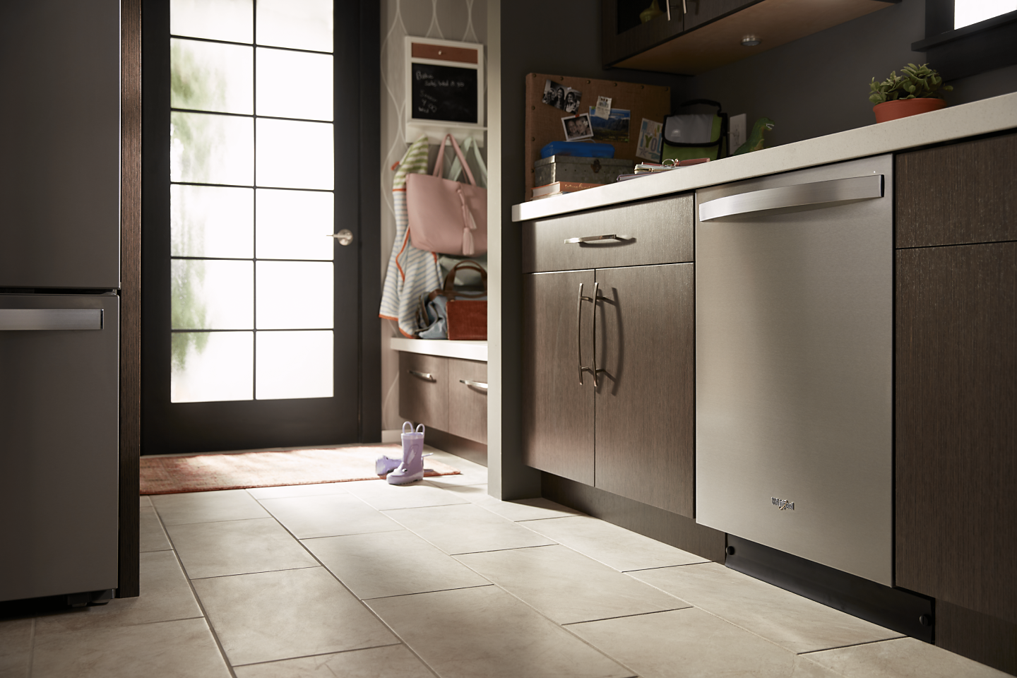Stainless steel Whirlpool® top control dishwasher in a kitchen