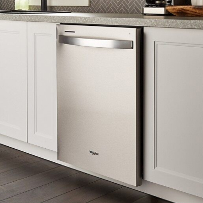 A closed Whirlpool® Dishwasher set between white cupboards