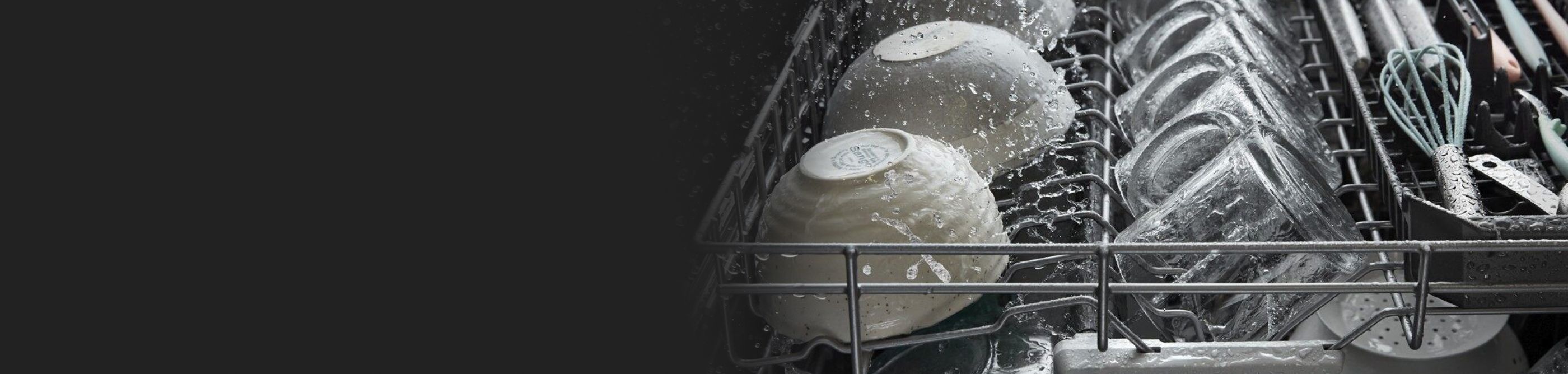 Two bowls in the top rack of a dishwasher