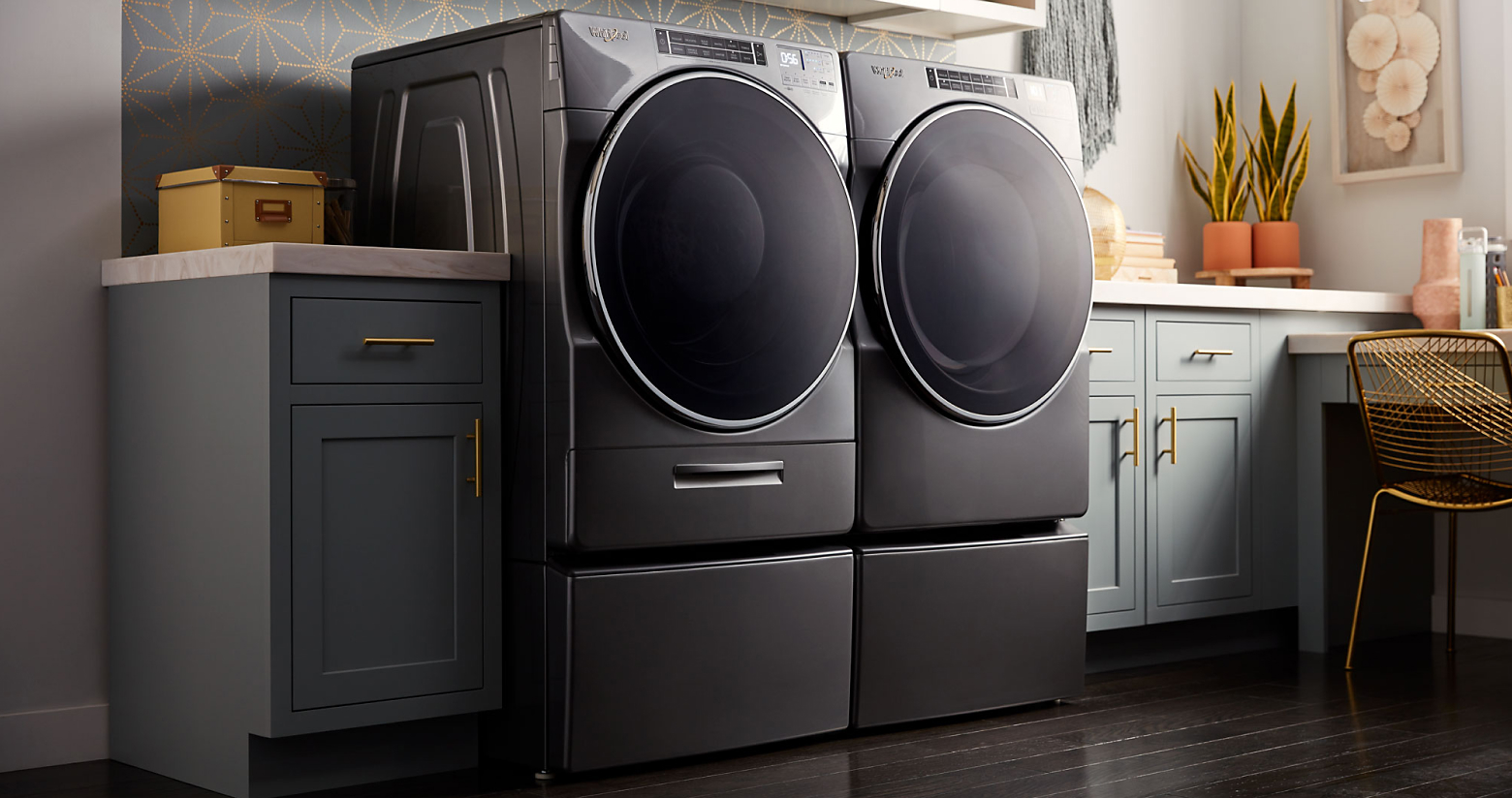 Whirlpool® front loading washer and dryer in a modern laundry room