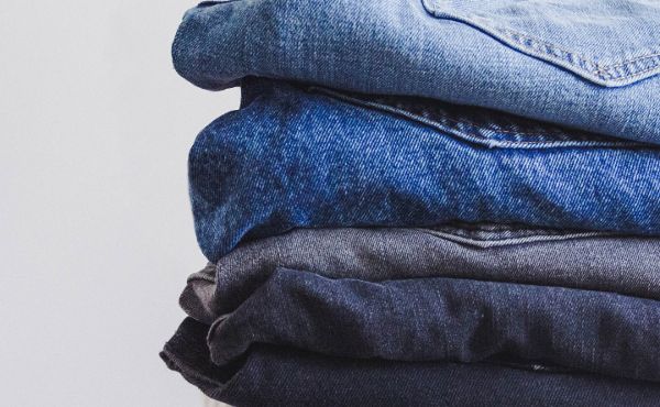 Folded jeans stacked in a pile