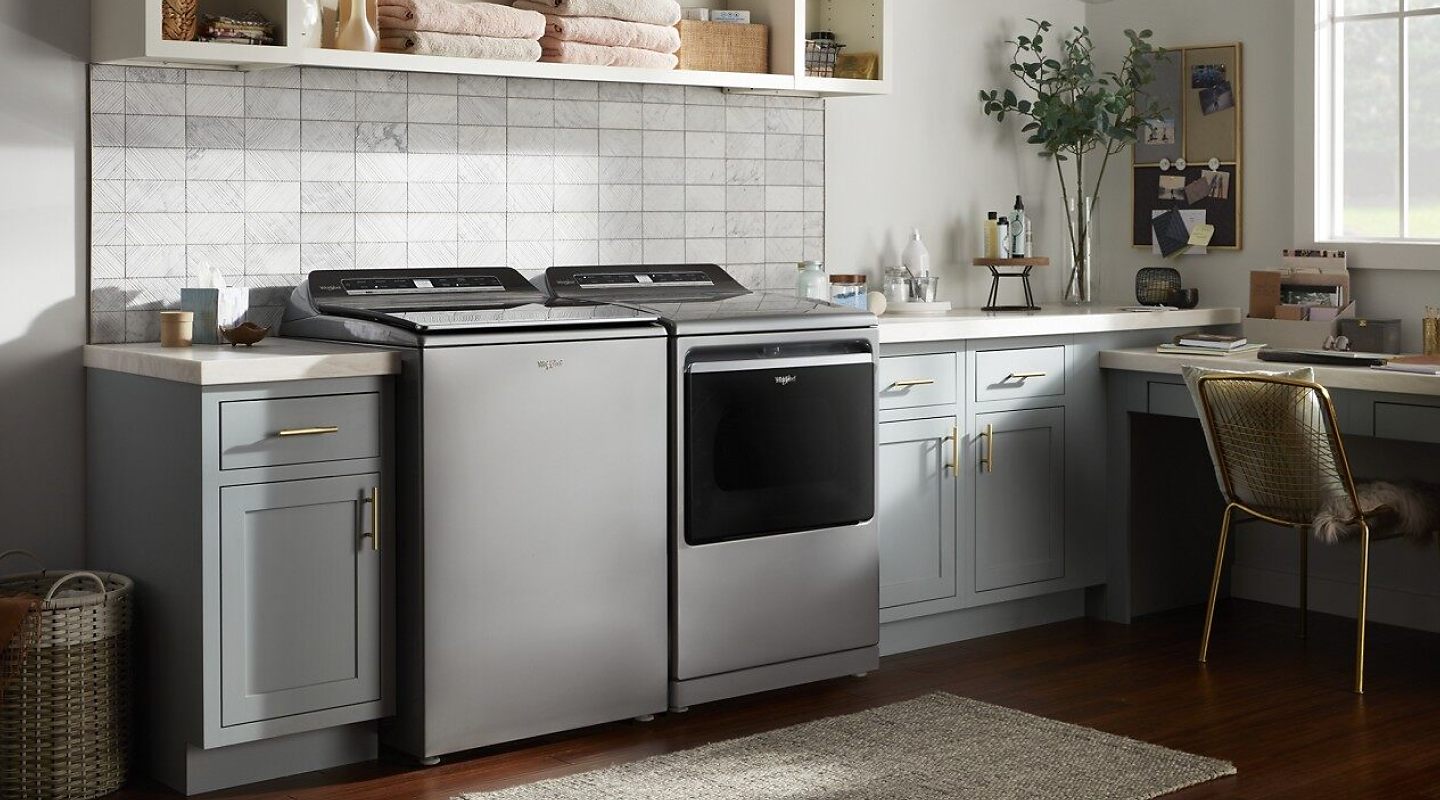 View of laundry room with Whirlpool® washer and dryer