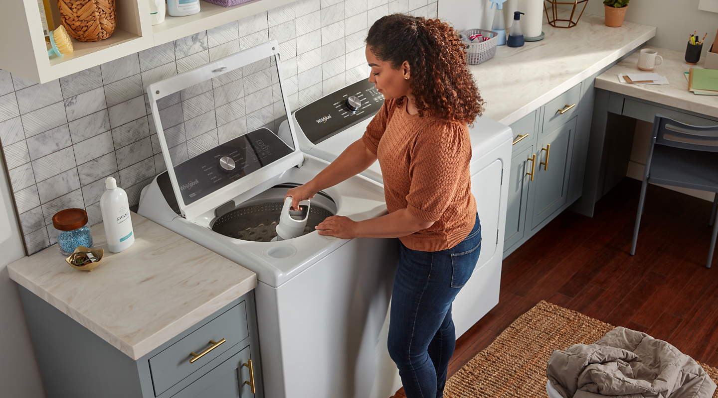 Person using Whirlpool® washer