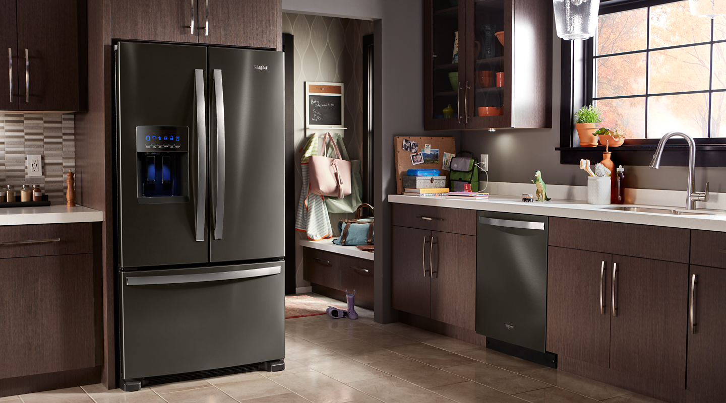 A Whirlpool® stainless steel refrigerator in a modern kitchen