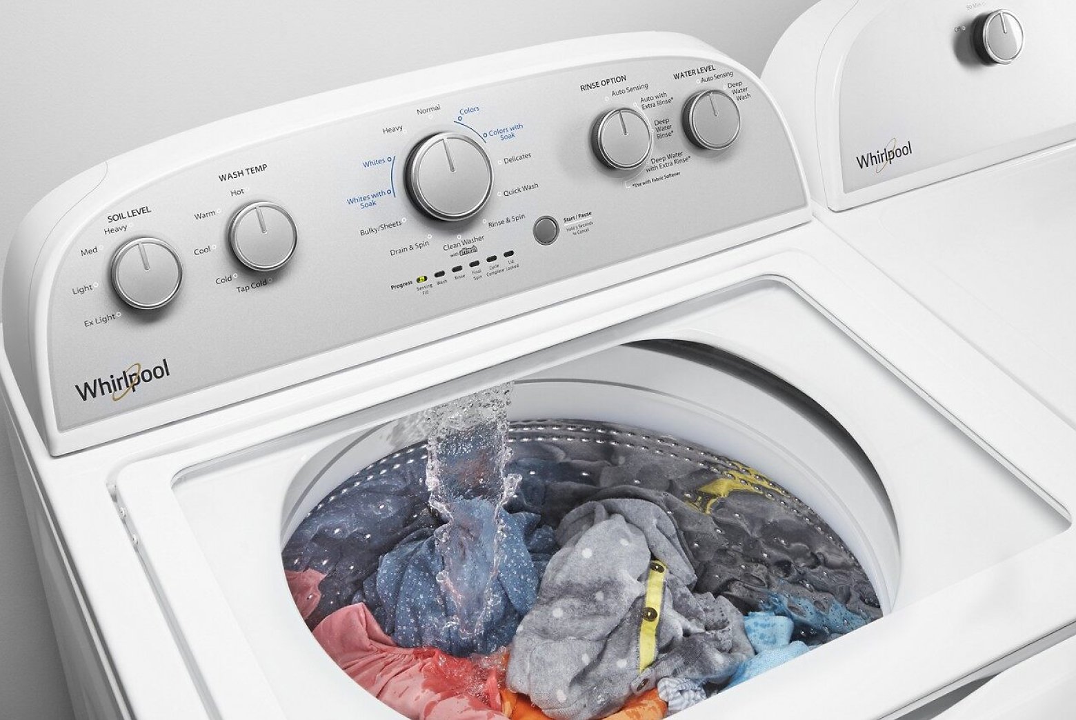 Water pouring on clothes in a washing machine