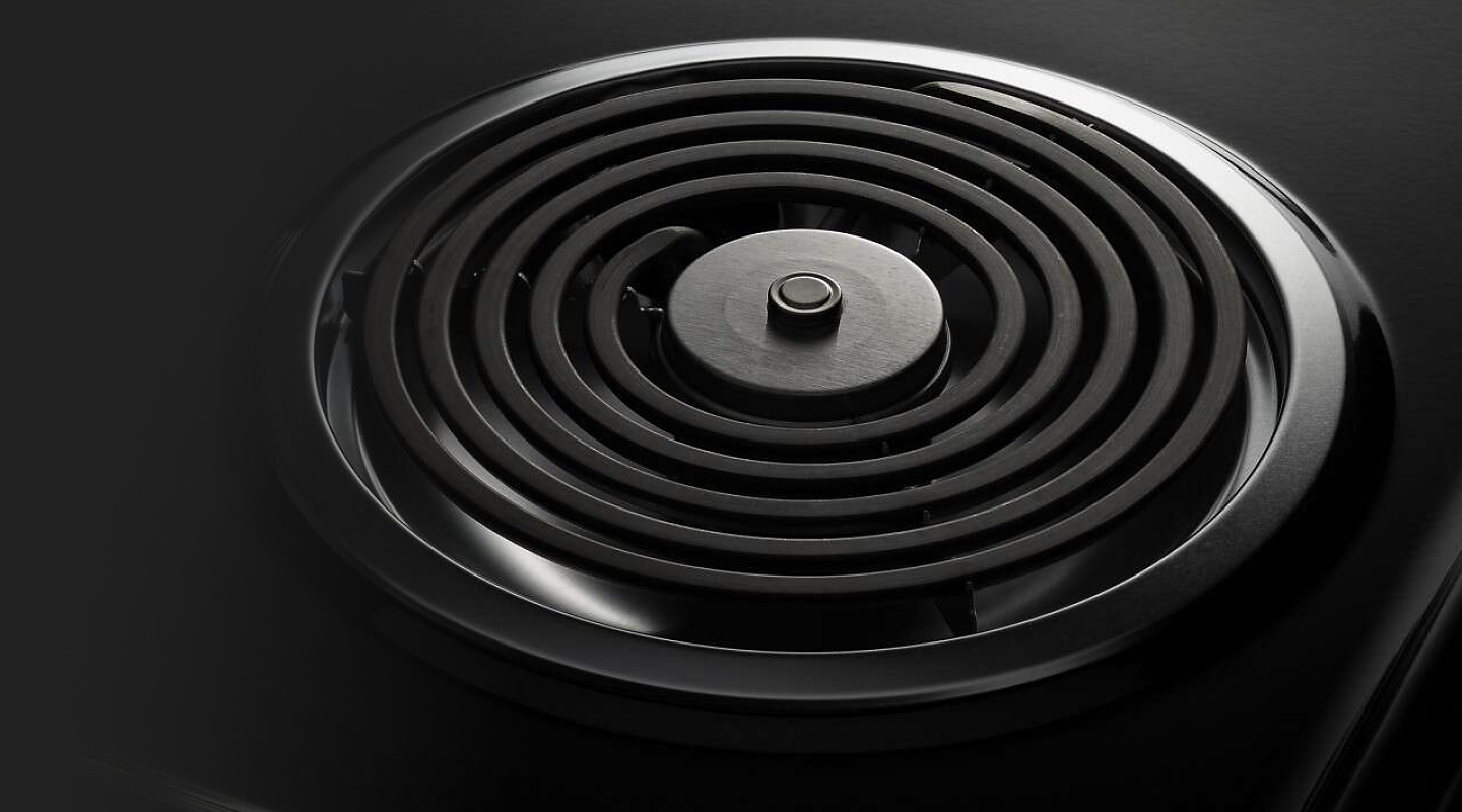 A closeup of an Amana® electric cooktop coil burner.