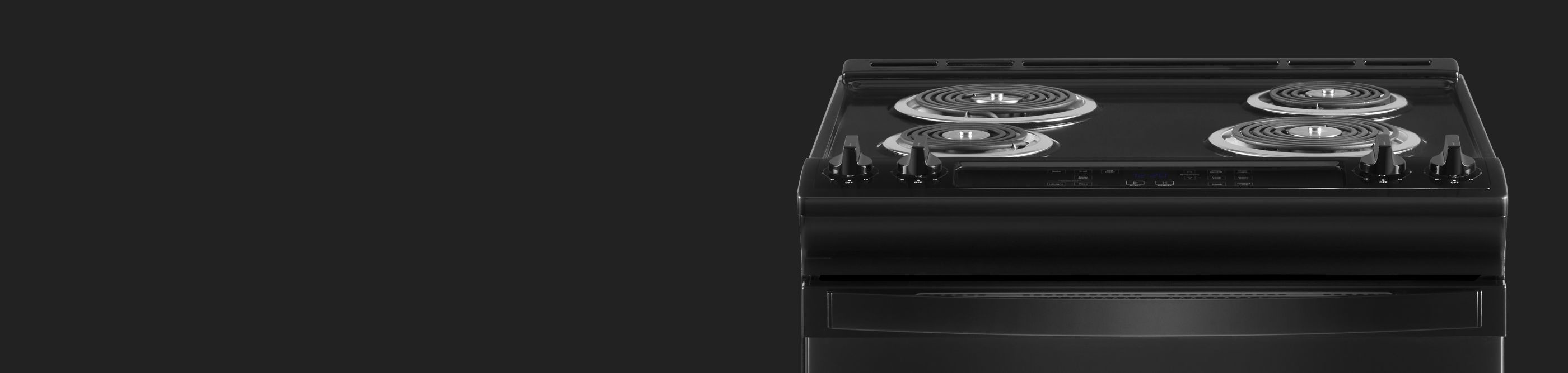 A closeup of a Whirlpool® electric oven cooktop with coil burners.