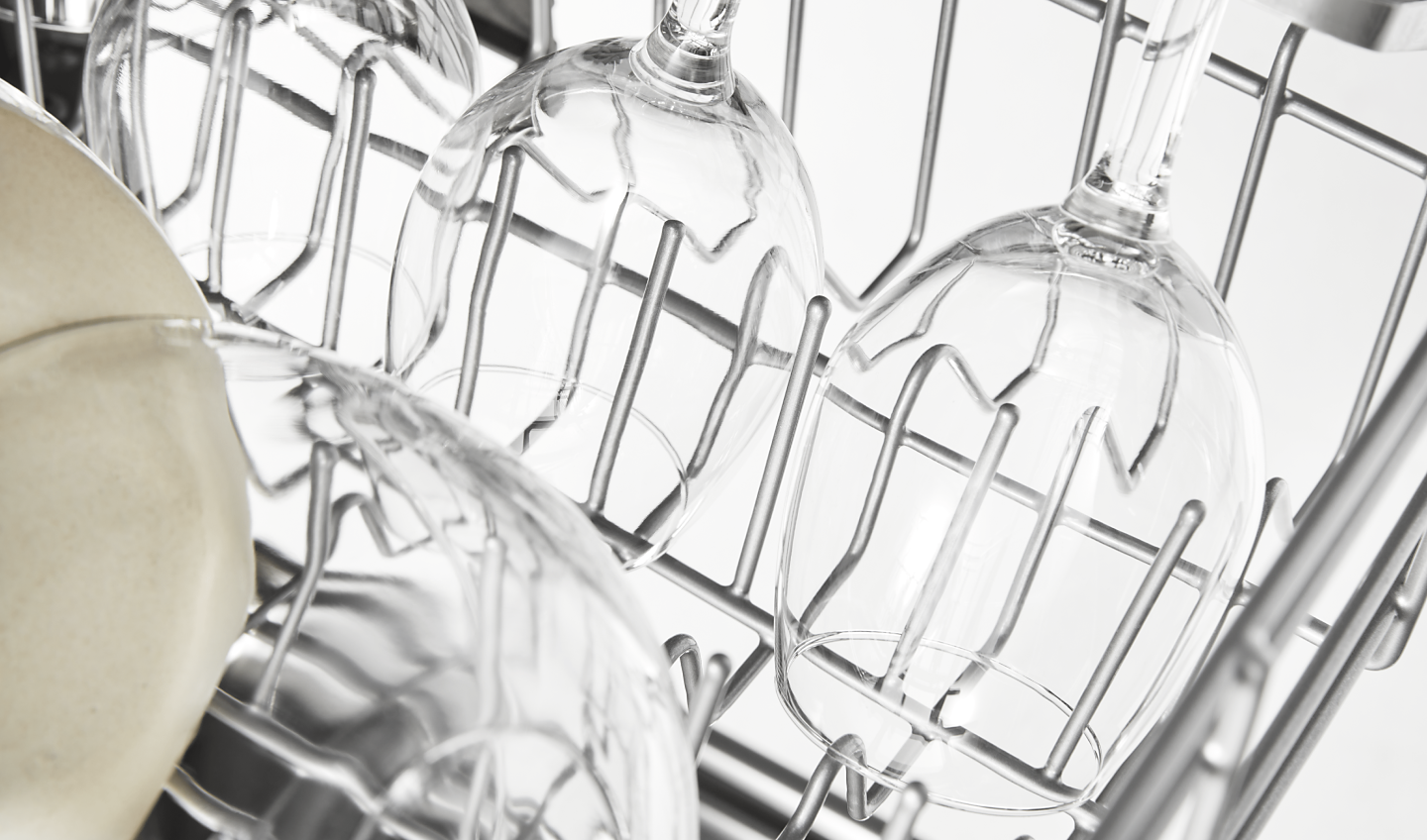Wine glasses in a dishwasher rack
