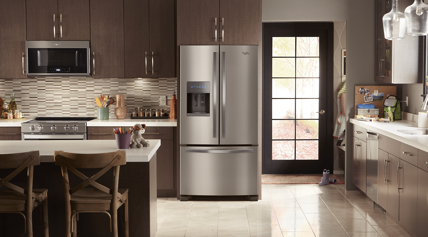 Stainless steel Whirlpool® French door refrigerator in a modern kitchen