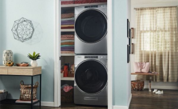 Stacked washer and dryer units inside a closet