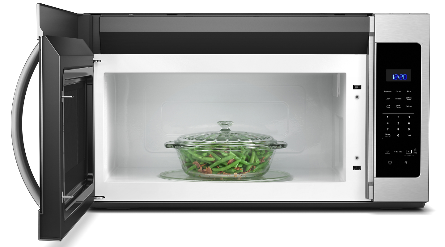 Casserole dish of green beans inside a microwave