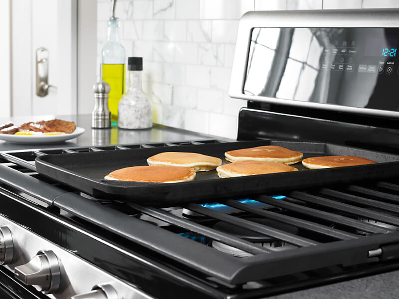 Pancakes cooking on a griddle