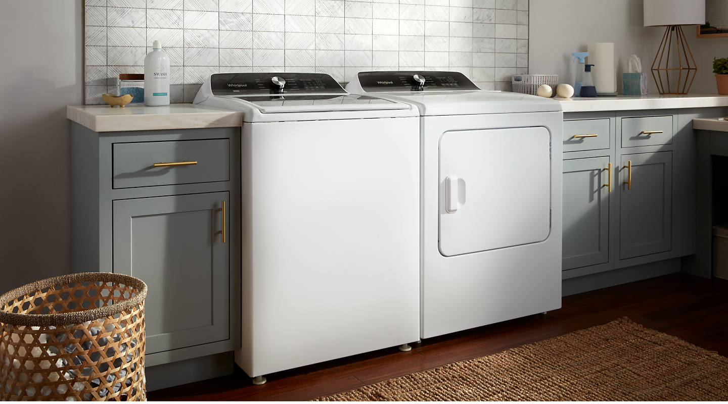 A white Whirlpool® washer and dryer set. A white Whirlpool® washer and dryer set.