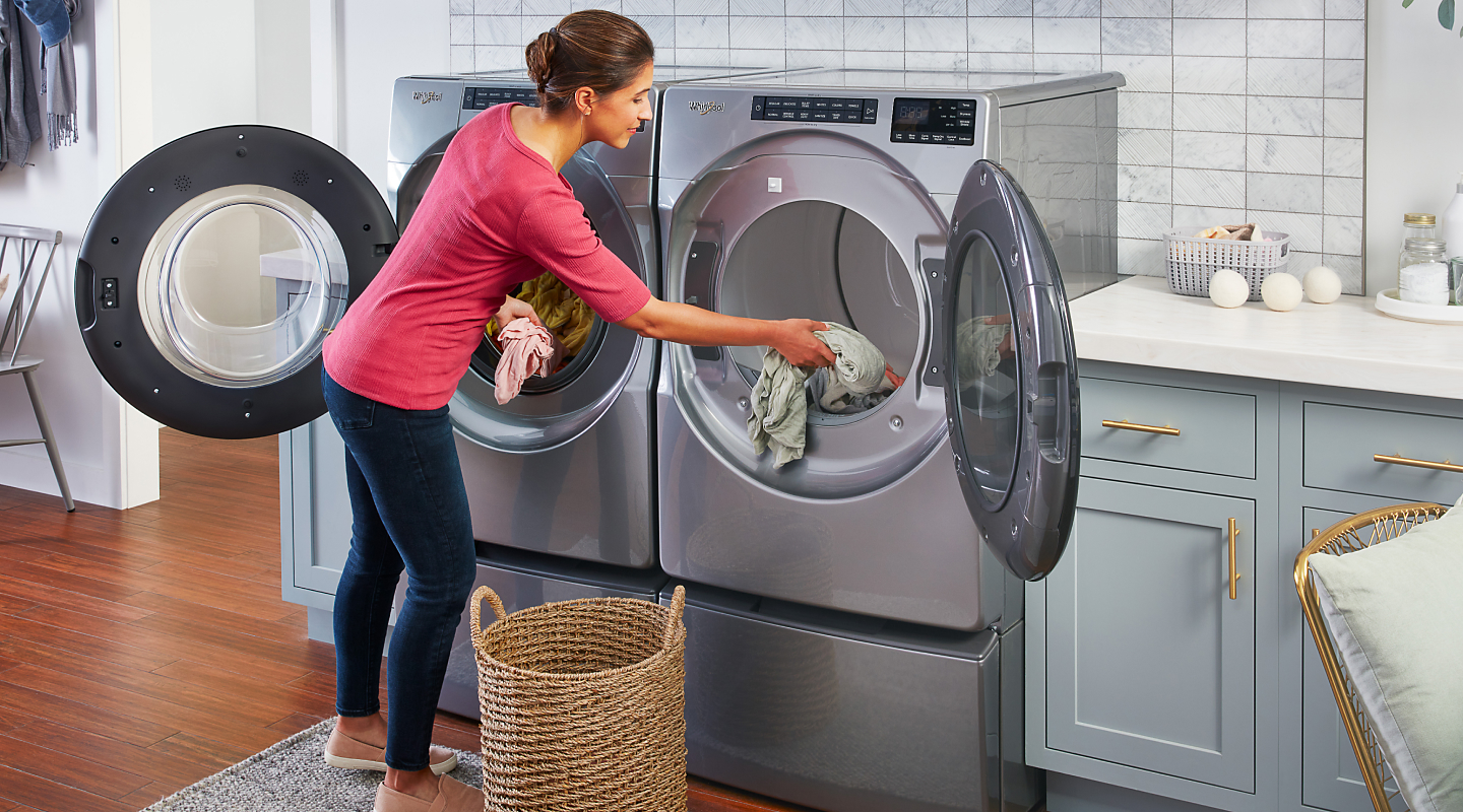 A woman loading laundry