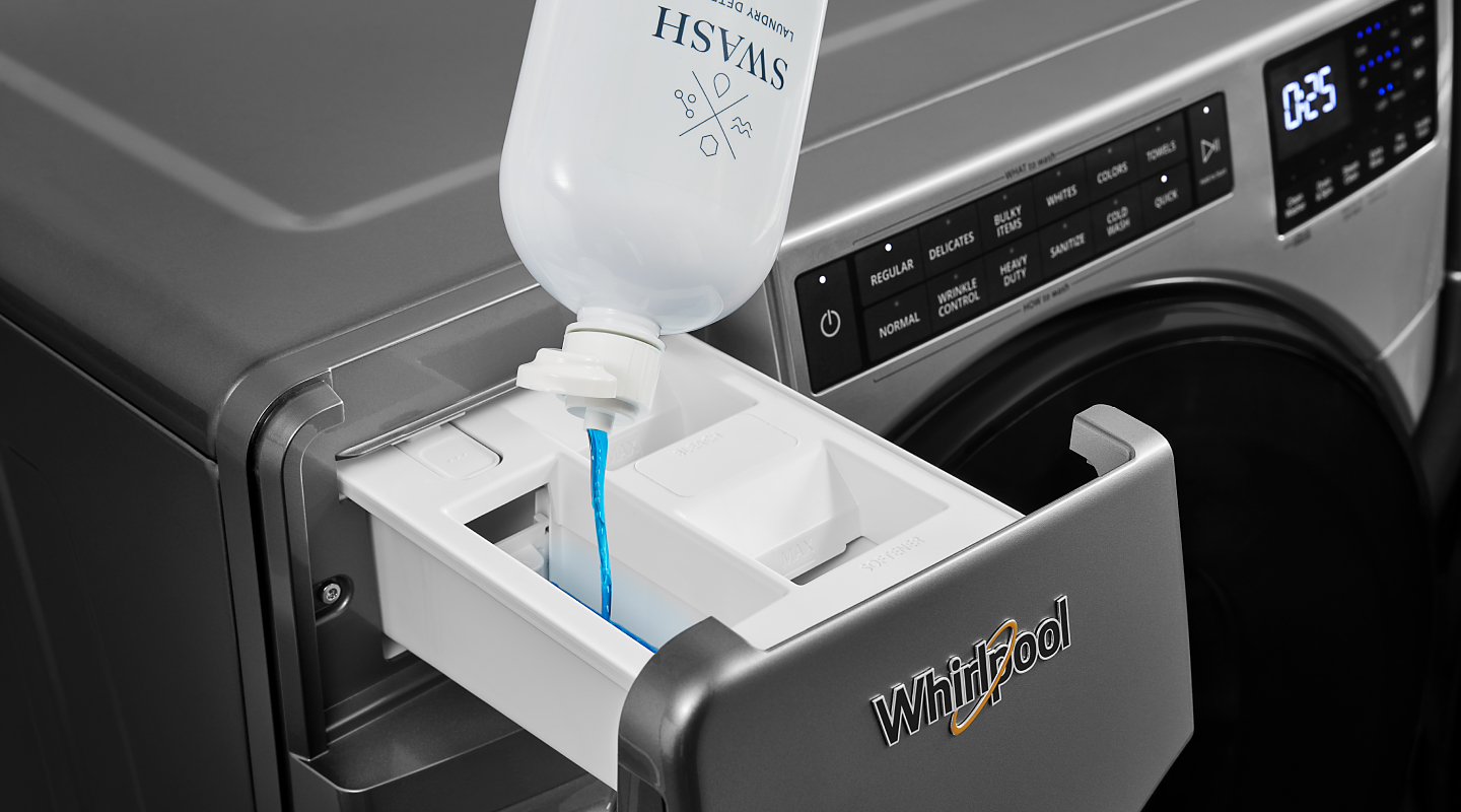 Swash® detergent being poured in a detergent drawer
