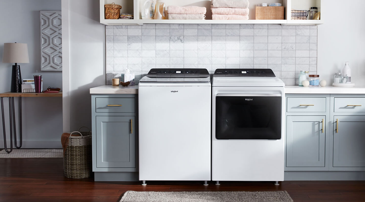 Whirlpool® washer dryer set in a white themed laundry room