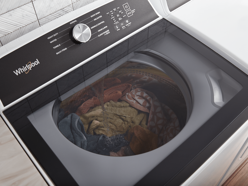 Black and white Whirlpool washer with washing knits