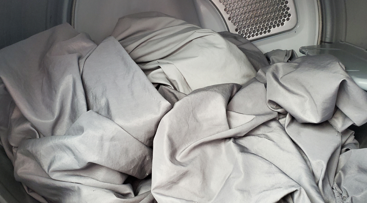 Interior of Whirlpool® dryer with sheets Interior of Whirlpool® dryer with sheets