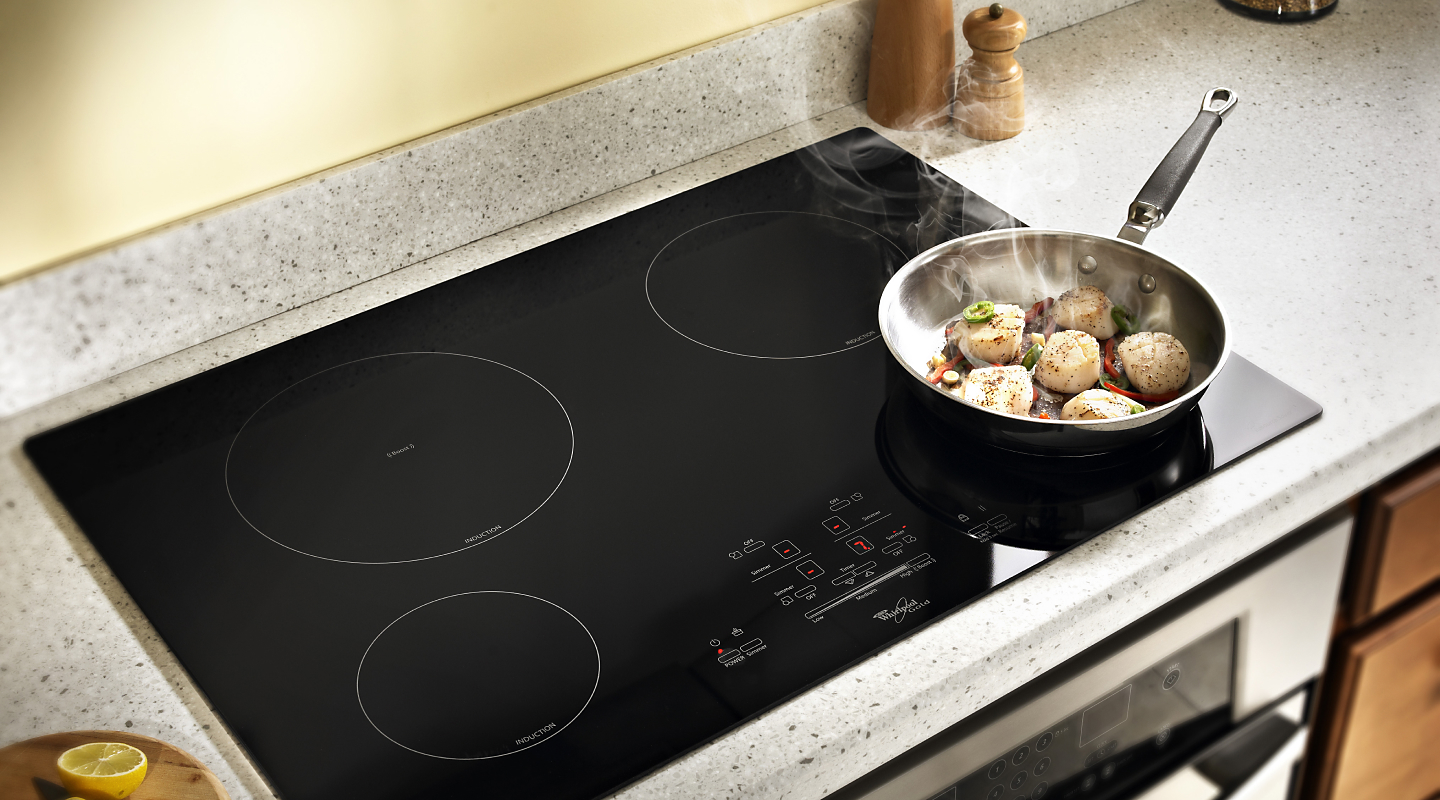 Food cooking on a Whirlpool® induction cooktop