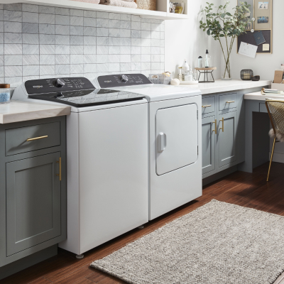 A laundry room featuring a Whirlpool® washer and dryer