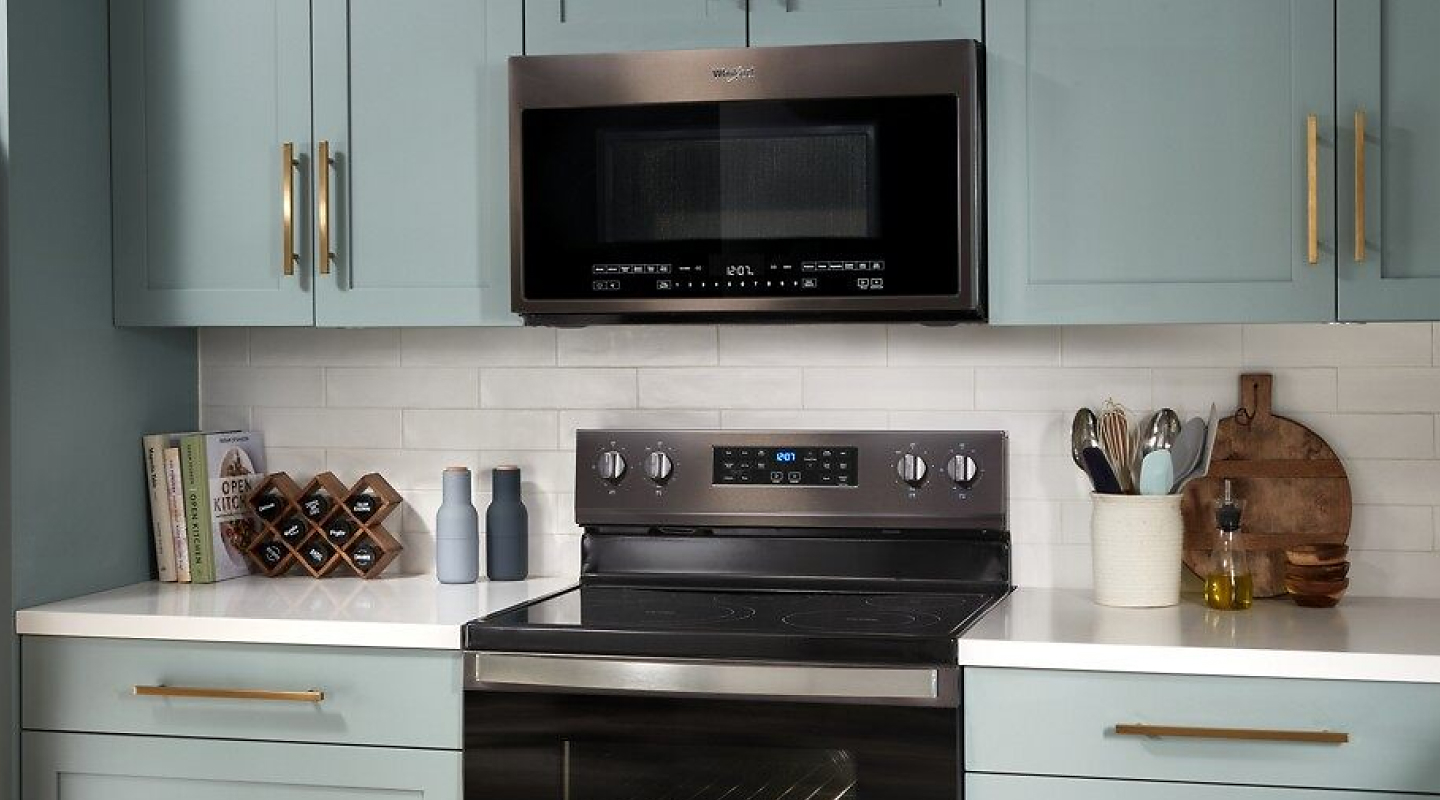 A Whirlpool® over-the-range microwave and an electric range
