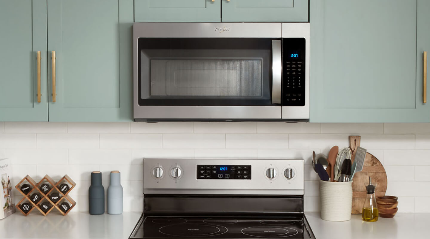 Whirlpool® over-the-range microwave above an electric range