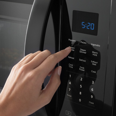Person using microwave settings