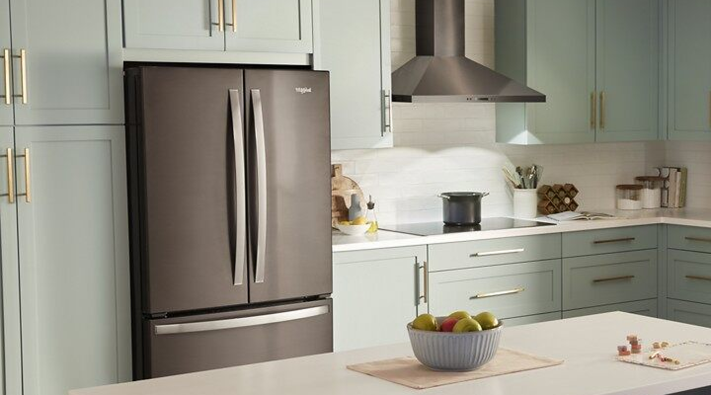 A multi-door Whirlpool® refrigerator in a modern kitchen.