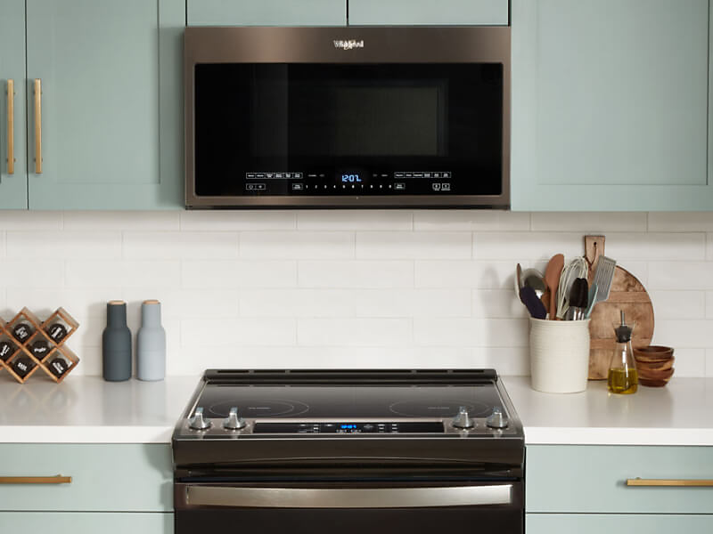 Whirlpool® over-the-range microwave installed above a Whirlpool® electric range