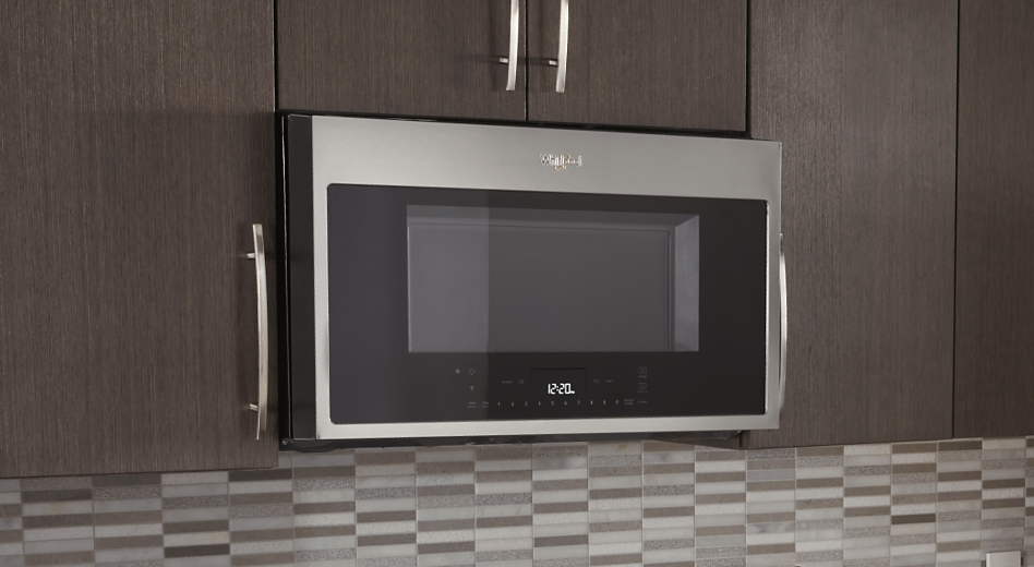 A smart Whirlpool® Microwave set in brown cabinets