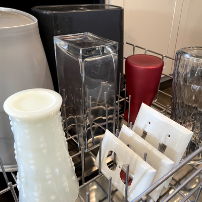 Home decor on the top rack of a dishwasher